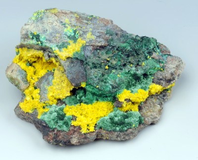 Metatyuyamunite: Metatyuyamunite (yellow) with malachite (green) from the Mashamba West Mine, Katanga, Democratic Republic of the Congo. Size: 7 x 6.5 x 2.5 cm, cat. no. M 4283.