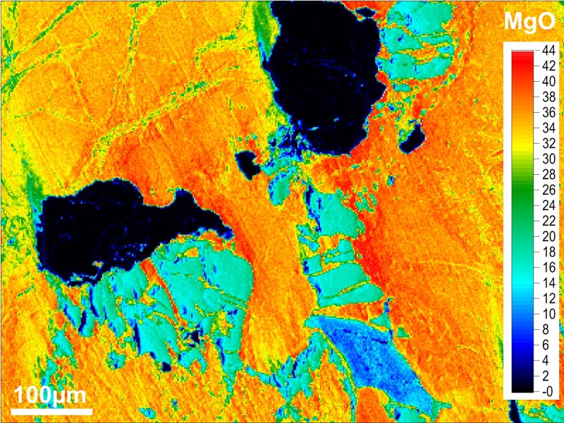 Quantitative false color-coded element distribution map for magnesium in a basalt. Colors refer to wt% oxid, showing the distribution of a selected element in the rock.: Color map of a basalt cross-section with irregular zones in orange, yellow, green, and blue. At right, a color scale for magnesium content from 8 to 44. Bright areas indicate high, dark areas low magnesium concentration. (AI-generated alt-text, generated with GPT-4.1-mini)