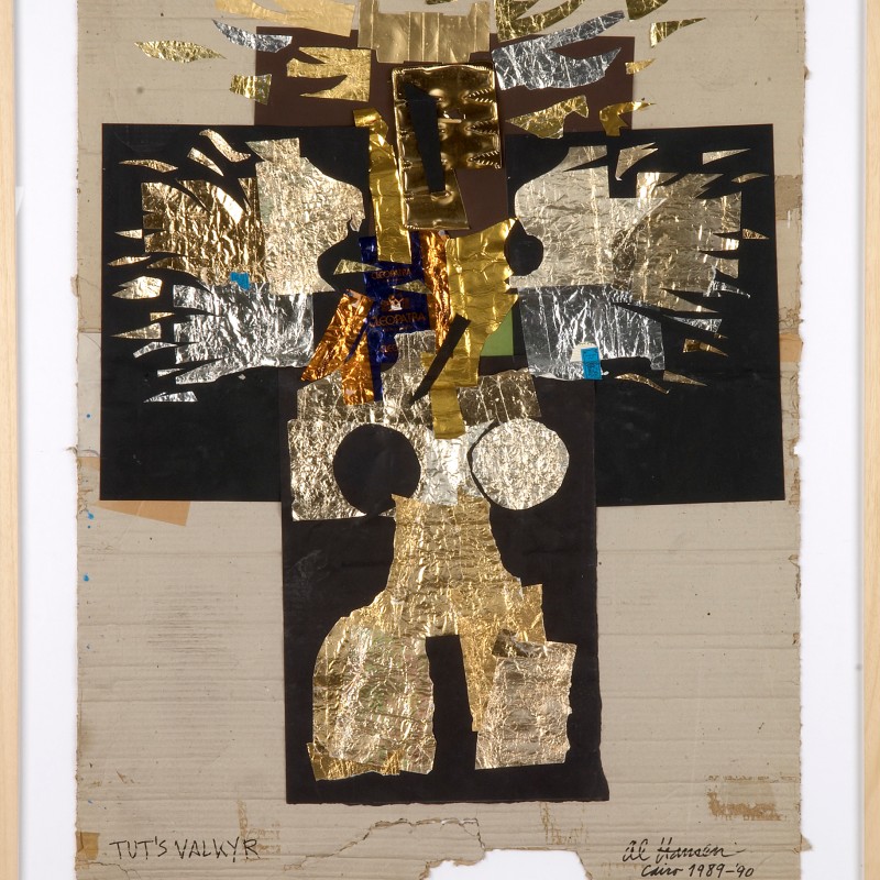Collage with gold and silver metal foil pieces on cardboard, arranged centrally with geometric and abstract shapes.
                                 Handwritten signature and date lower right. (AI-generated alt-text, generated with GPT-4.1-mini)