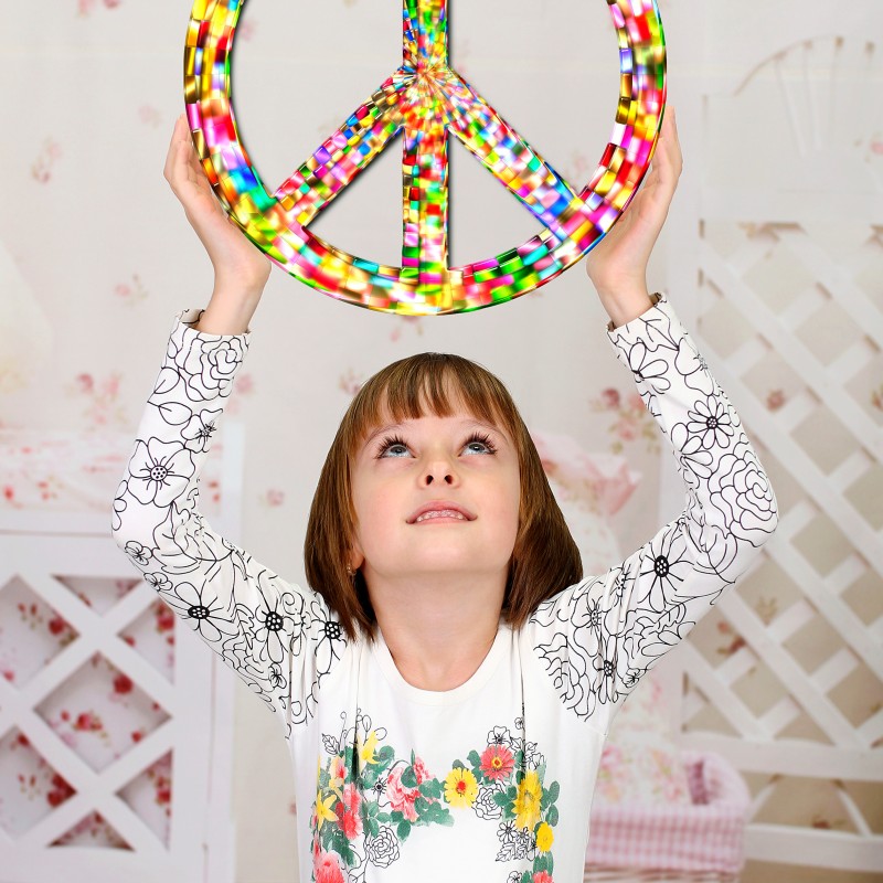 Girl with light brown hair holds a colorful, sparkling peace sign above her head and looks upward. Floral pattern
                                 on her white shirt. (AI-generated alt-text, generated with GPT-4.1-mini)