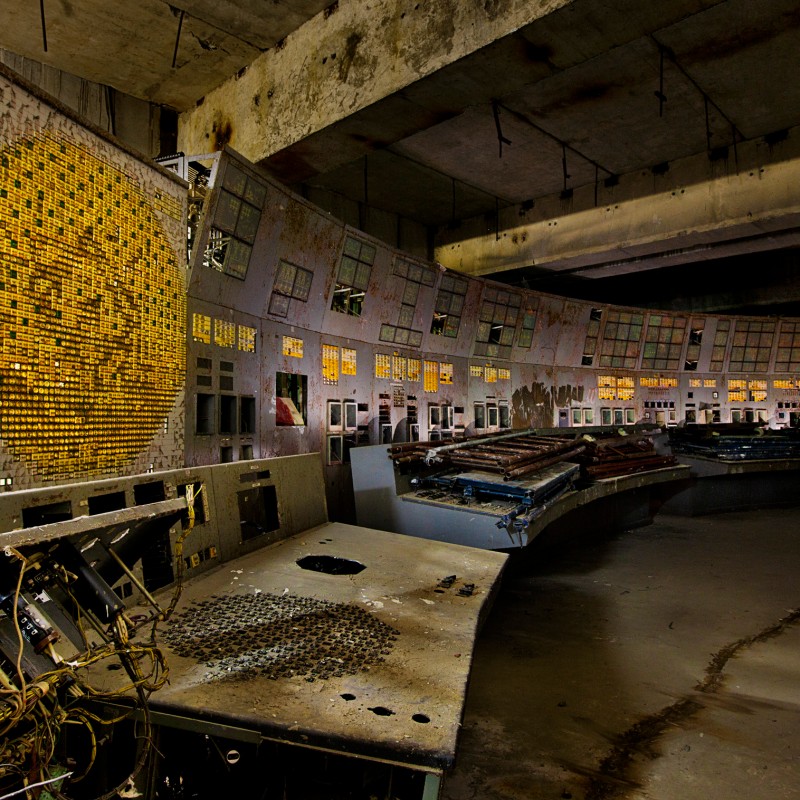 Abandoned control room with multiple indicator panels, buttons, and damaged equipment; walls and ceiling appear
                                 heavily aged. (AI-generated alt-text, generated with GPT-4.1-mini)